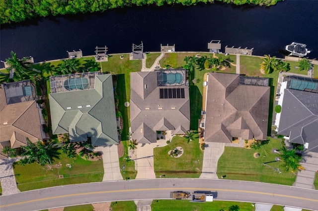 birds eye view of property with a water view