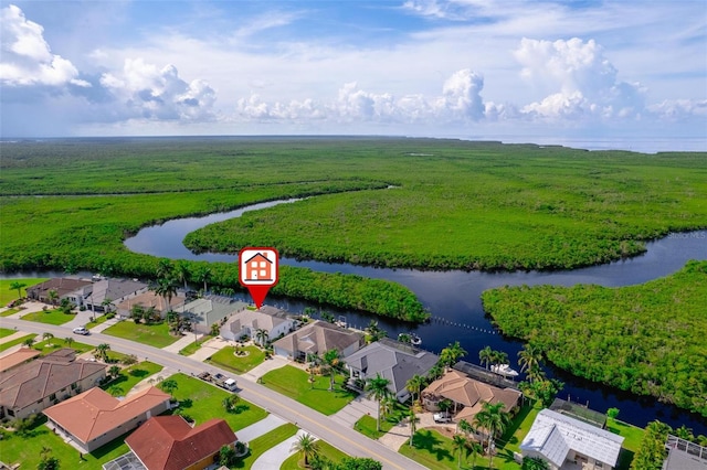 drone / aerial view featuring a rural view and a water view