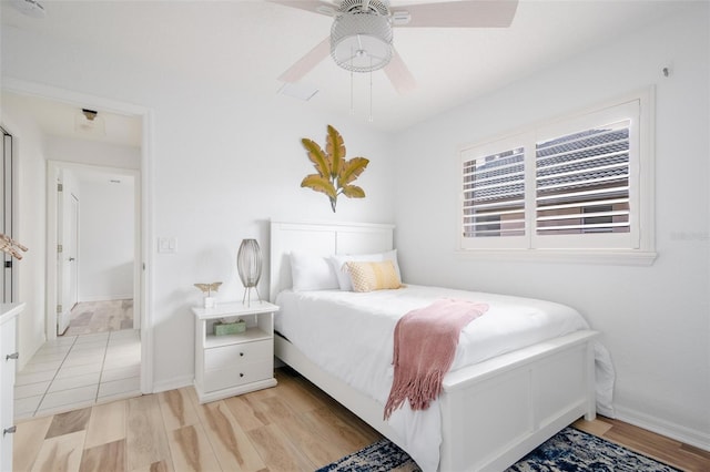 bedroom featuring ceiling fan and light hardwood / wood-style floors