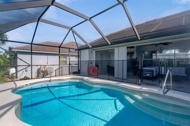 view of pool featuring ceiling fan, a lanai, and a patio