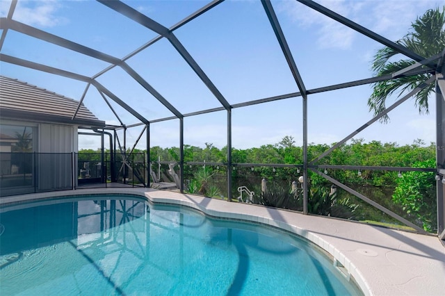 view of pool with a lanai