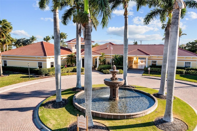 view of property's community with a yard