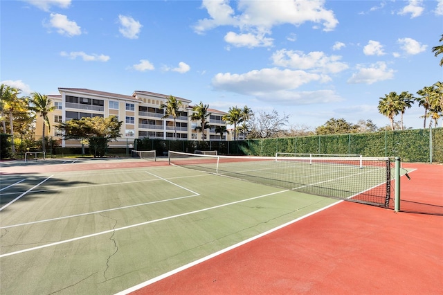 view of tennis court featuring basketball court