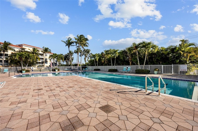 view of swimming pool with a patio