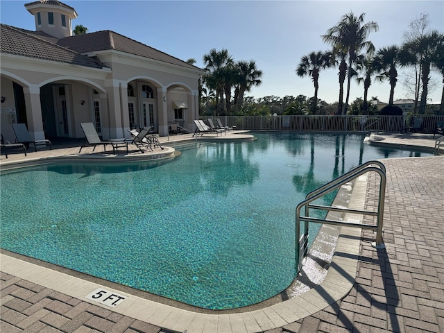 view of swimming pool featuring a patio area