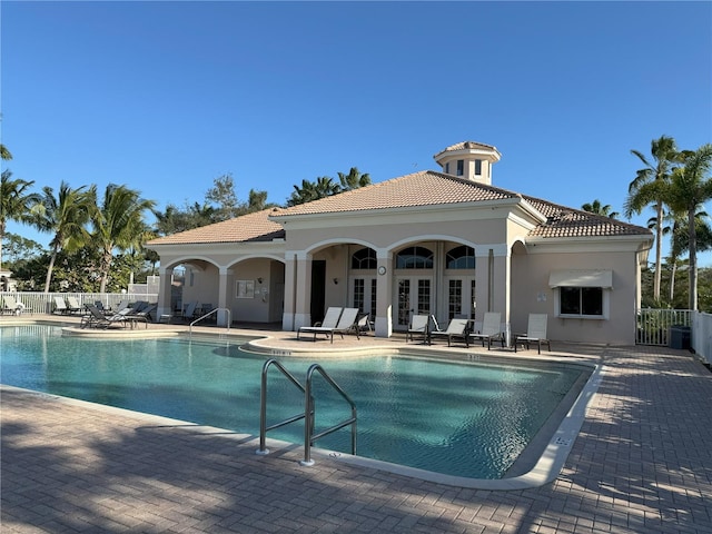 view of pool with a patio area and french doors