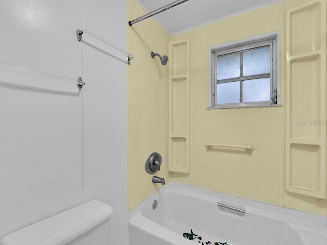 bathroom featuring toilet and tub / shower combination