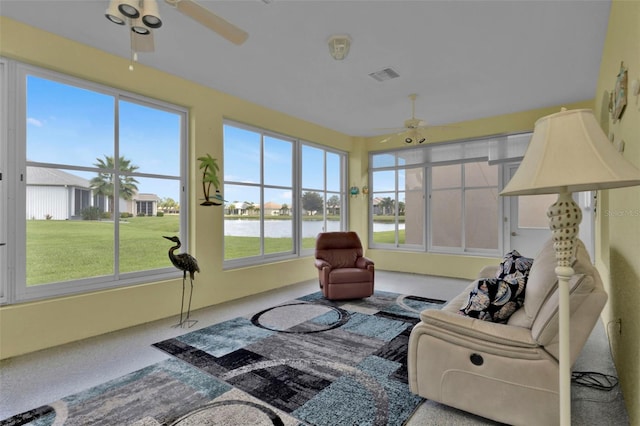 sunroom / solarium featuring ceiling fan