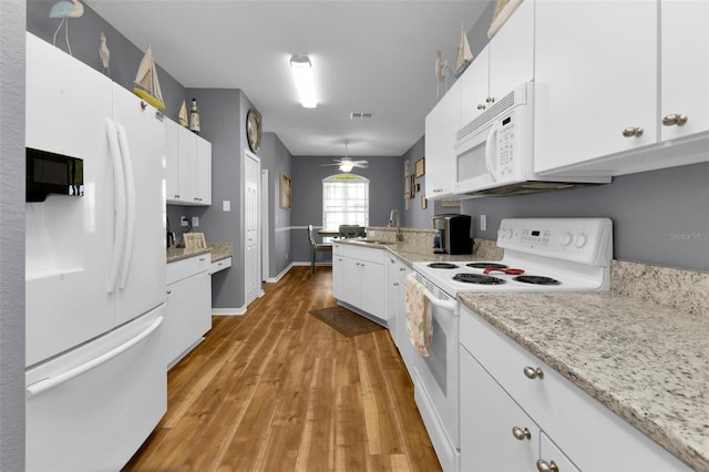 kitchen with white cabinets, white appliances, sink, and ceiling fan