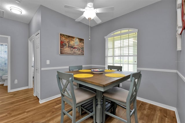 dining room featuring hardwood / wood-style floors and ceiling fan