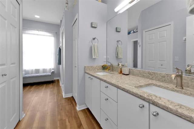 bathroom with vanity and hardwood / wood-style floors