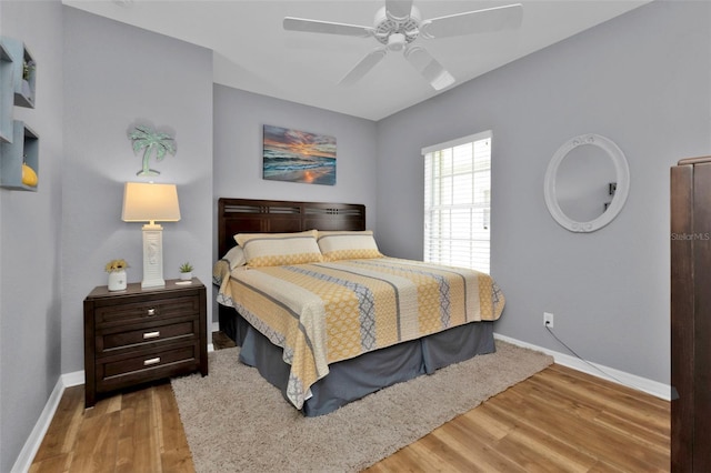 bedroom featuring light wood-type flooring and ceiling fan