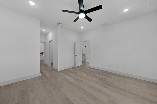 unfurnished room featuring light wood-type flooring and ceiling fan