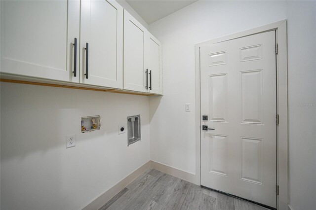 washroom featuring washer hookup, hookup for an electric dryer, cabinets, and light hardwood / wood-style flooring