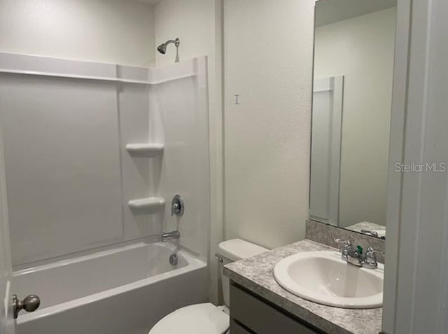 full bathroom with vanity, toilet, and washtub / shower combination