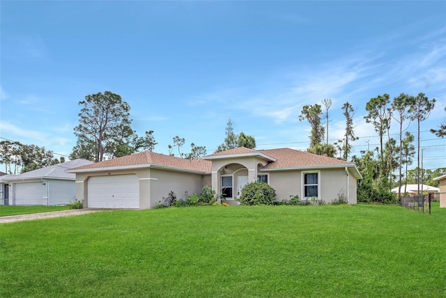 view of front facade with a garage and a front lawn