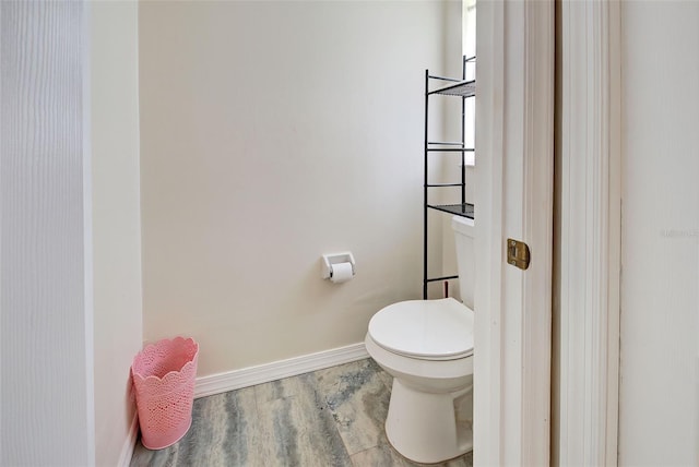 bathroom featuring toilet and hardwood / wood-style flooring