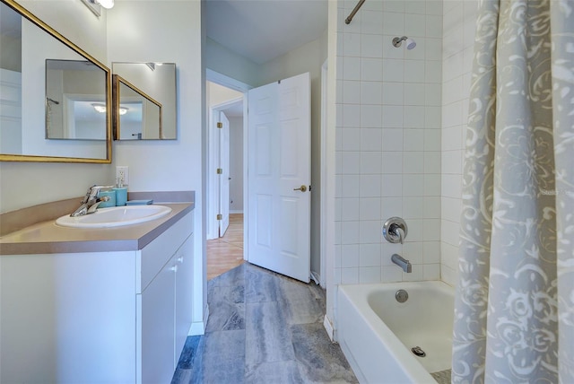 bathroom with shower / tub combo with curtain and vanity