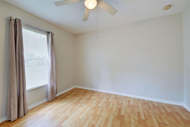 empty room featuring ceiling fan and light hardwood / wood-style floors