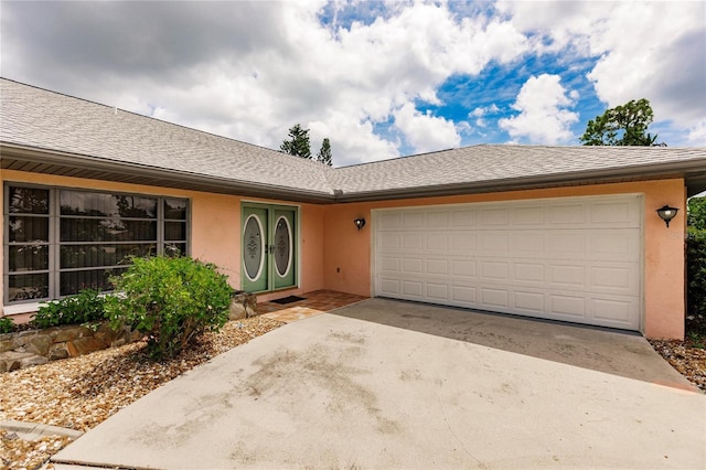 ranch-style home featuring a garage