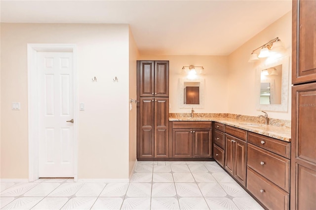 bathroom featuring tile patterned flooring and vanity