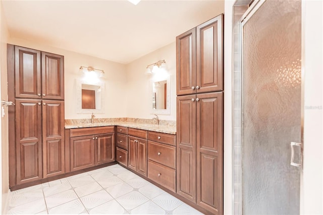 bathroom with tile patterned floors, walk in shower, and vanity