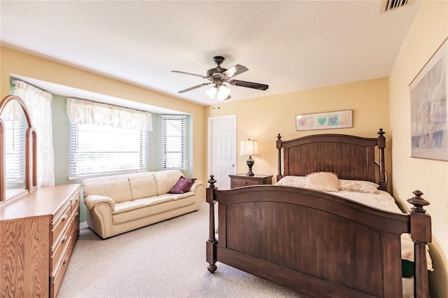 bedroom with ceiling fan and carpet floors