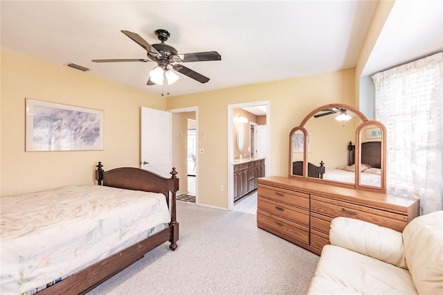 bedroom featuring ceiling fan and ensuite bath