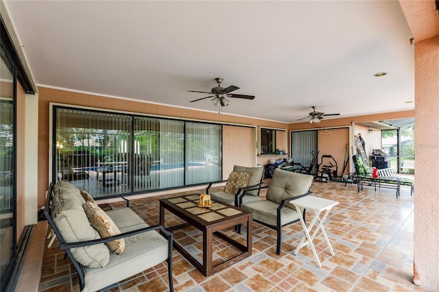 interior space with ceiling fan