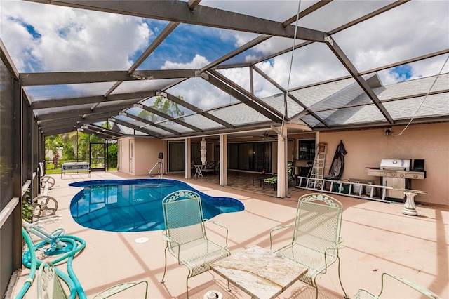 view of pool featuring grilling area, a lanai, and a patio