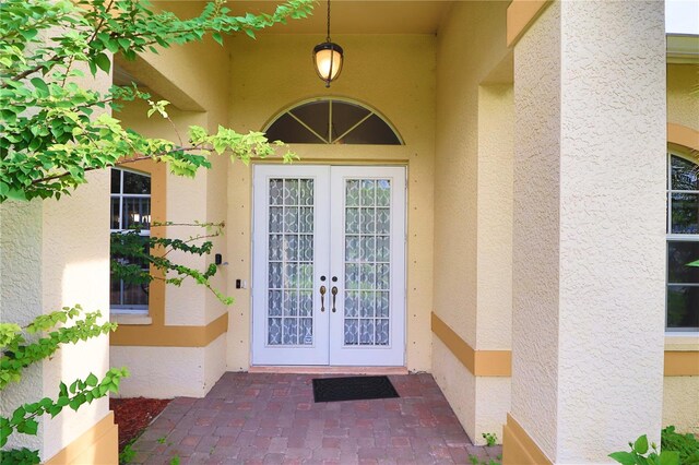 property entrance featuring french doors