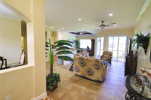 living room featuring crown molding and ceiling fan