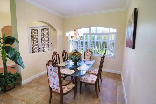 dining room featuring crown molding and a chandelier