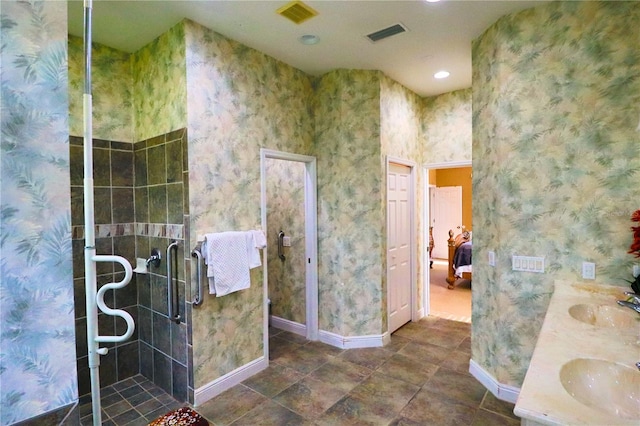 bathroom with vanity and an enclosed shower