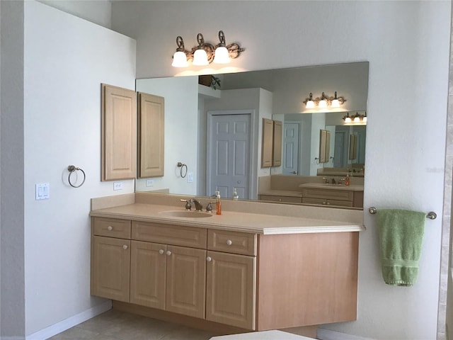 bathroom with tile patterned floors and vanity