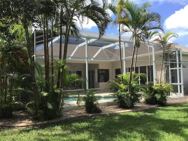 rear view of property with a lanai