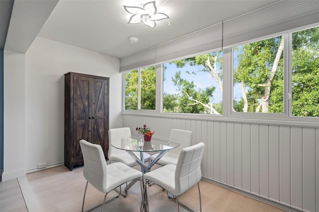 dining space with a healthy amount of sunlight and light wood-type flooring