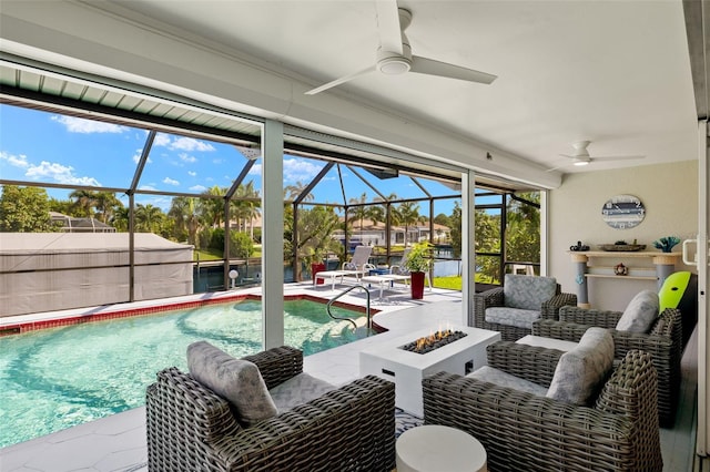 exterior space featuring ceiling fan, a patio area, and glass enclosure