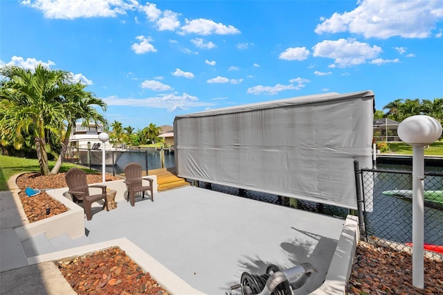 view of patio featuring a water view