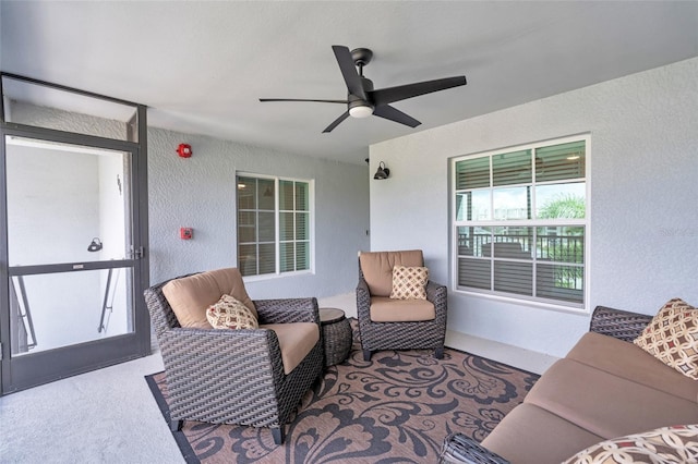 view of patio featuring ceiling fan