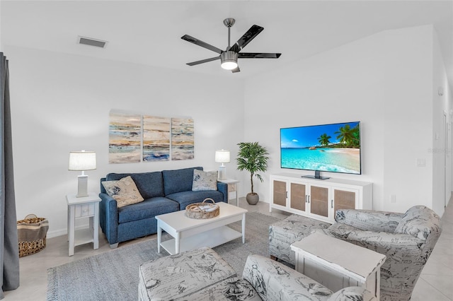 living room with ceiling fan and light tile patterned floors