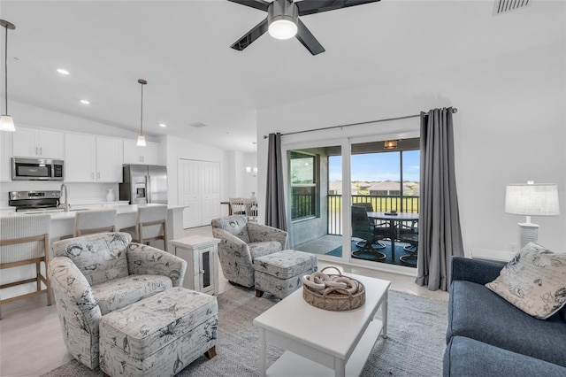 living room featuring lofted ceiling and ceiling fan