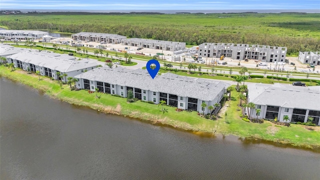 birds eye view of property with a water view