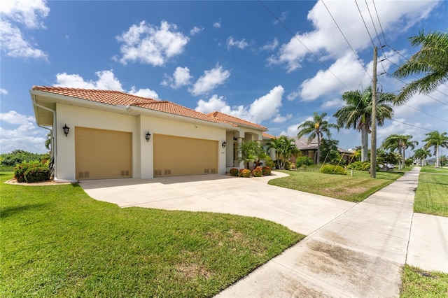 view of front of house featuring a garage and a front lawn