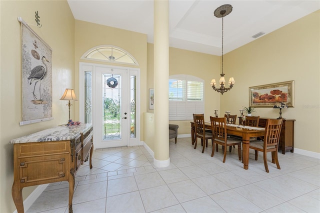 entrance foyer with plenty of natural light, light tile patterned floors, and a chandelier