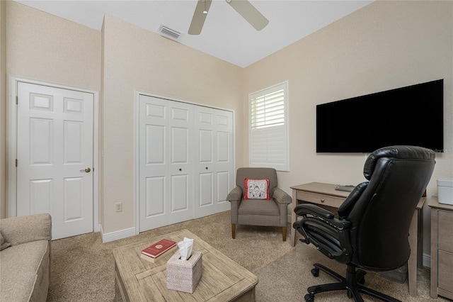 carpeted office featuring ceiling fan