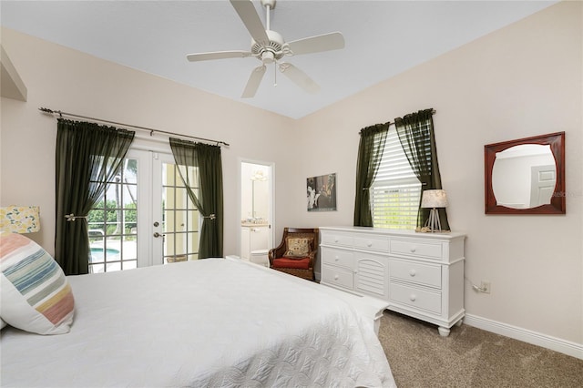 carpeted bedroom featuring access to exterior, ceiling fan, ensuite bath, and french doors