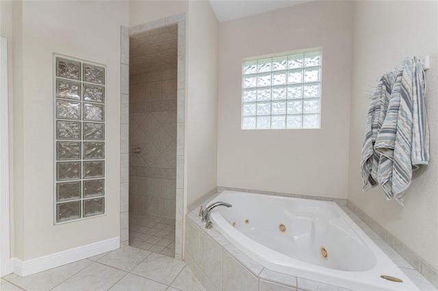 bathroom featuring independent shower and bath and tile patterned flooring