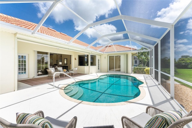 view of pool featuring a lanai and a patio area