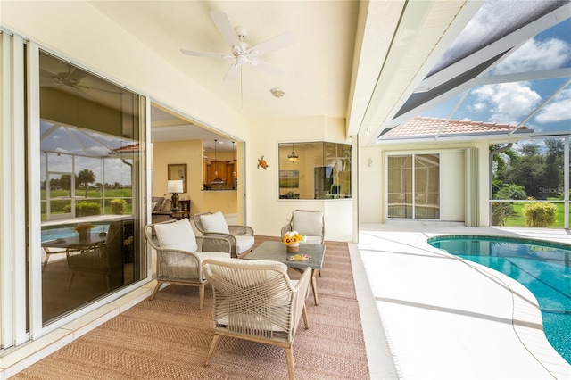 exterior space with an outdoor living space, glass enclosure, and ceiling fan